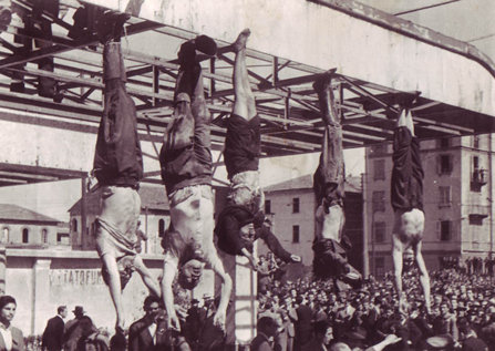 Dead bodies hanging from a metal structure