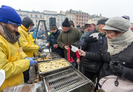 Poor and homeless being fed on Christmas Eve by volunteers