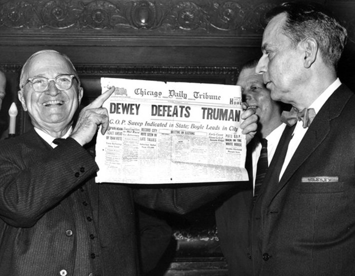 President Truman holding up newspaper declaring he had lost election he actually won