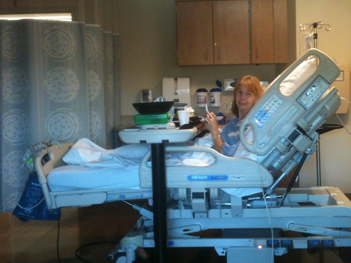 Jeannie, Wayne’s wife, in a hospital bed