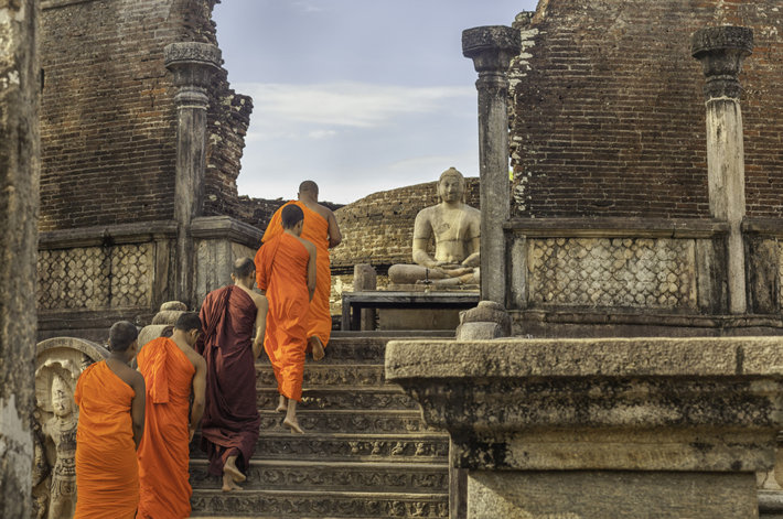 Buddhist monks walking in the famous Vatadage Temple in Polonnaruwa