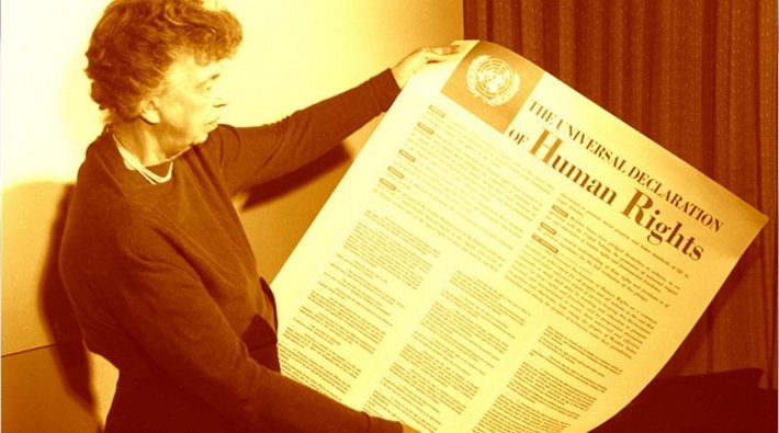 Eleanor Roosevelt holding the UDHR