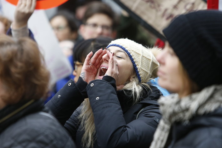 A woman shouting at a protest