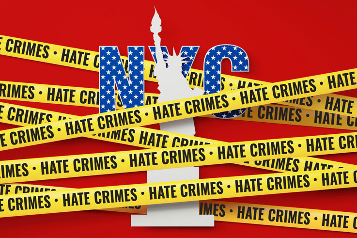 A Statue of Liberty with hate crimes tape across her