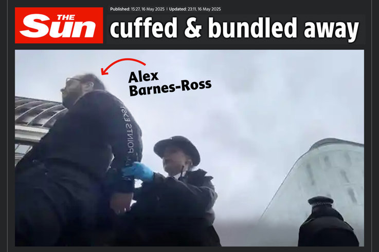 Alex Barnes-Ross handcuffed by police
