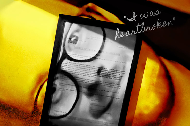 Alex Barnes-Ross framed with document