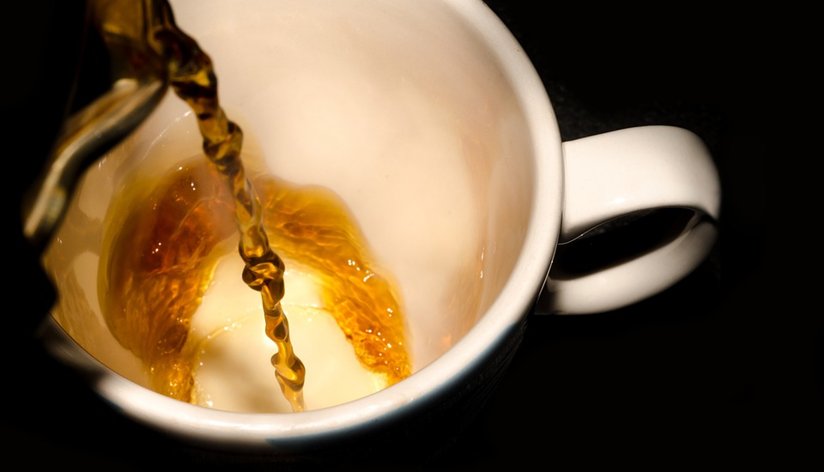 Coffee being poured into a mug