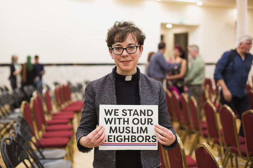 Woman holding sign