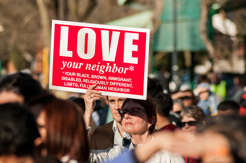 Woman holding a sign