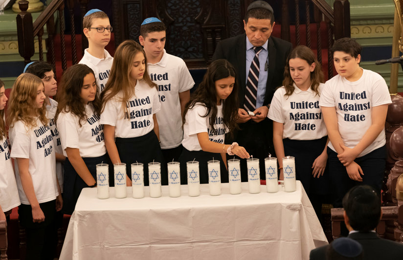 Children gathered around candles