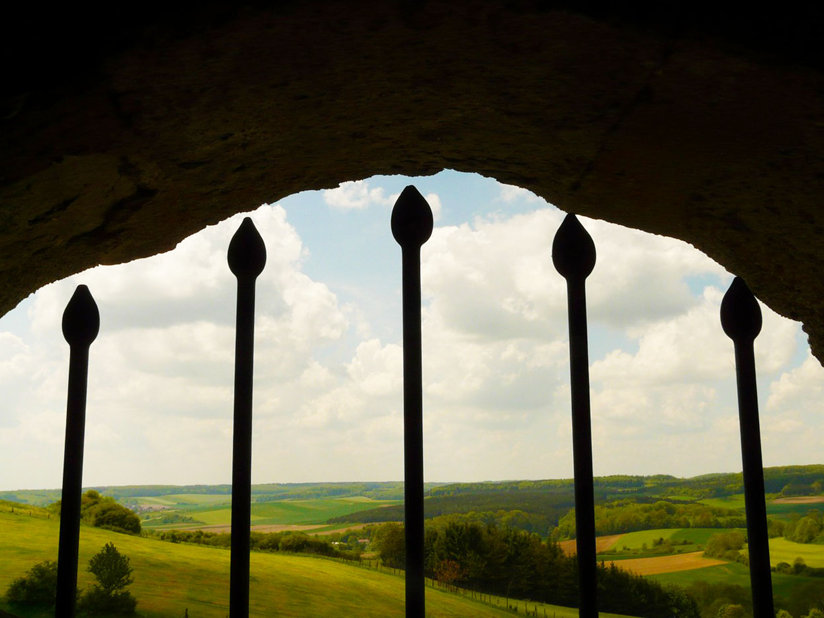 Window with bars looking out onto fields