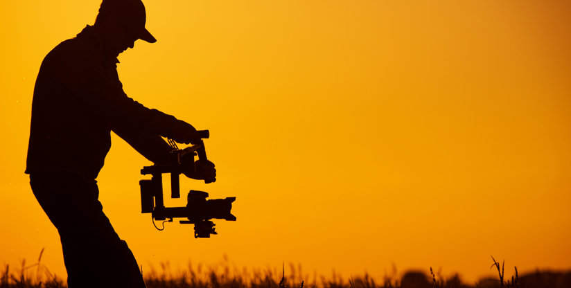 Man holding camera gear