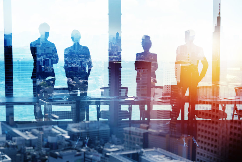 People in an office by a window