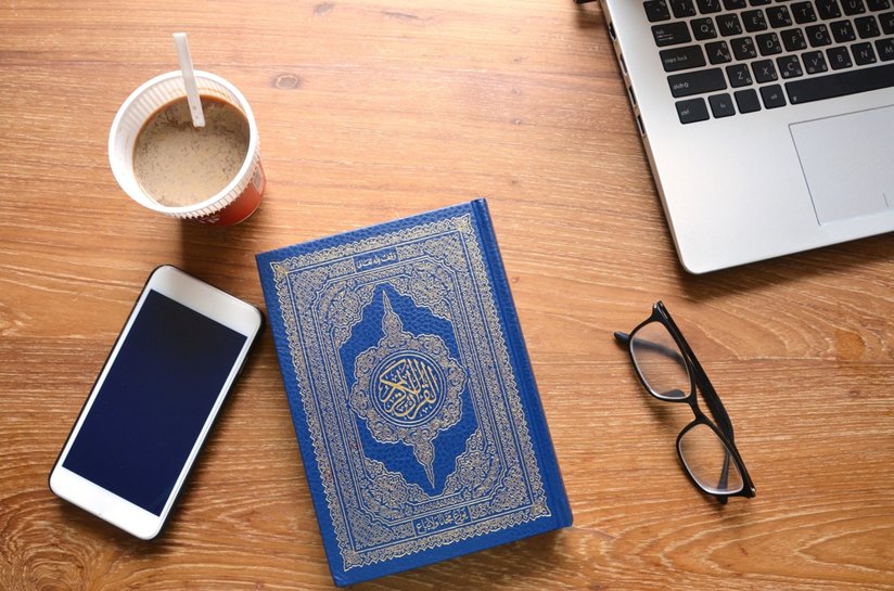 Quran near lap top