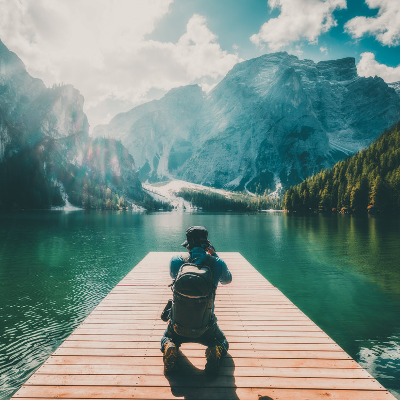 Man taking a photo in nature