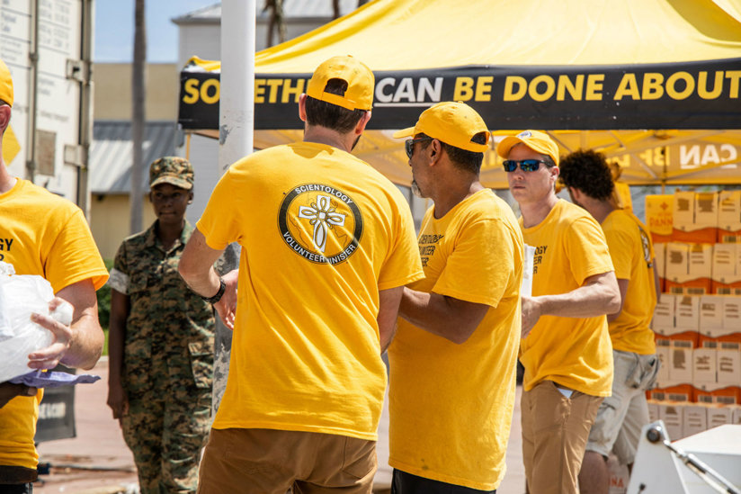 People working in yellow shirts