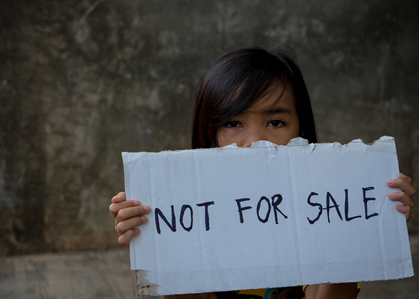 Girl holding sign