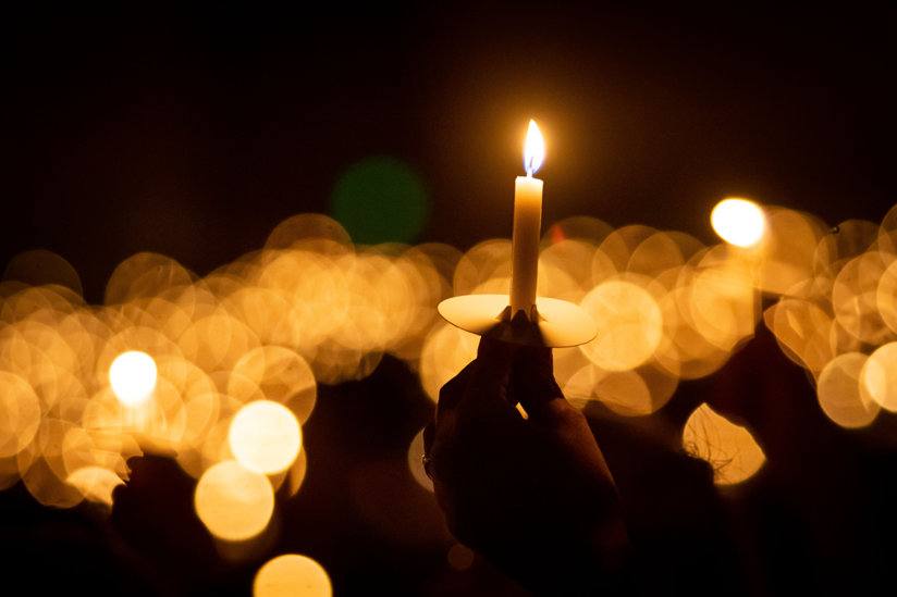 People holding candles