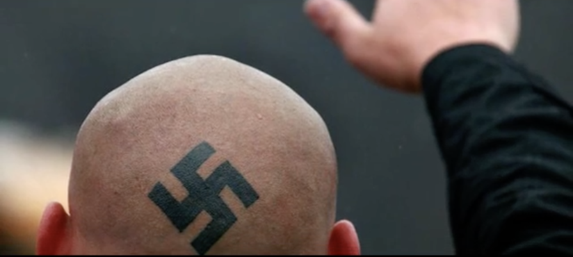 Swastika tattoo on head