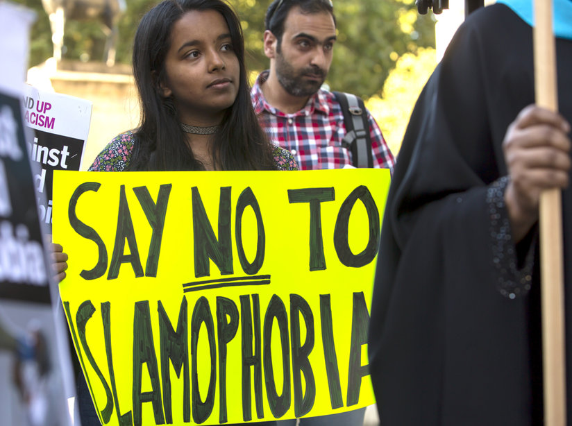 A protest with a sign against Islamophobia