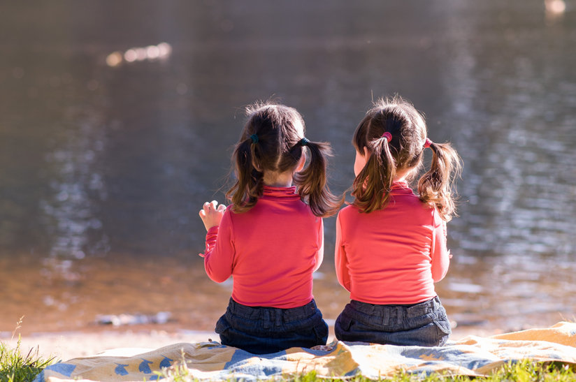 Two little girls side by side wearing the same thing