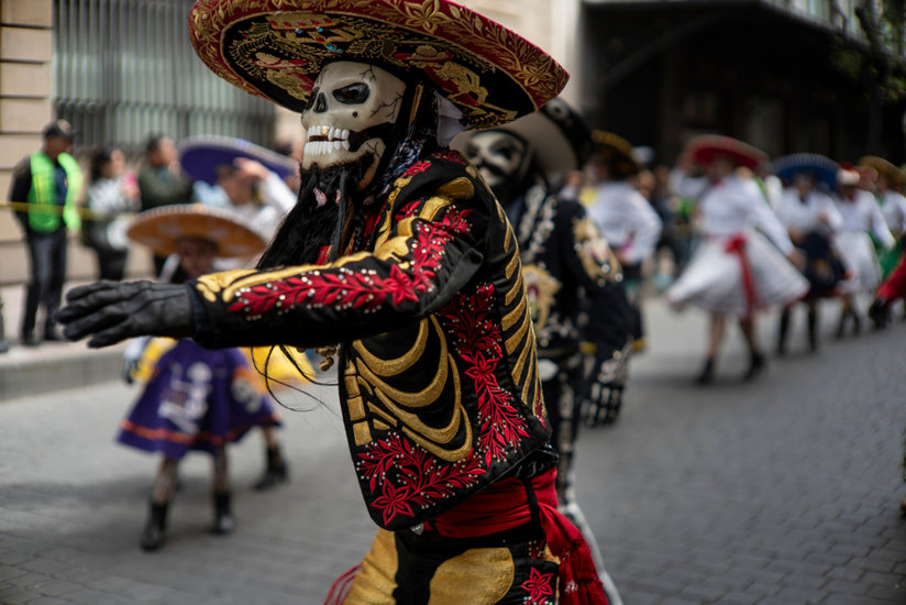 A man in a skeleton mask