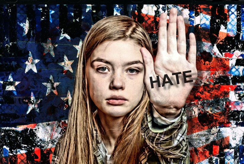 Young girl in front of American flag