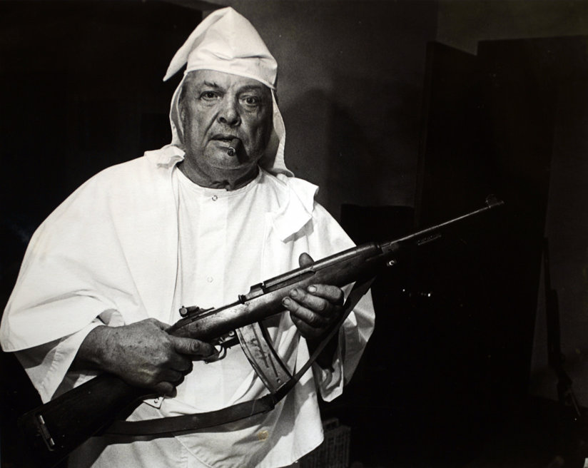 KKK member with a gun